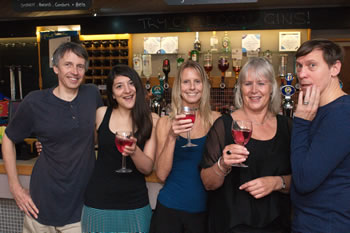 a group of dancers at the bar
